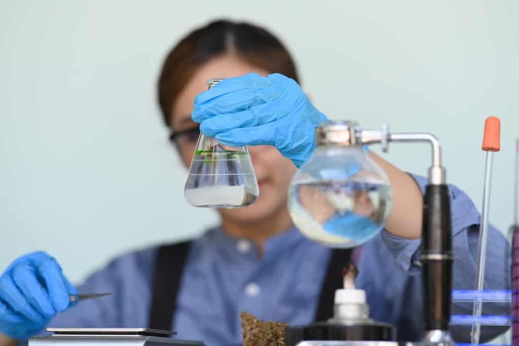 Scientific laboratory equipment illustrating the molecular research behind smooth nicotine salt e-liquids.
