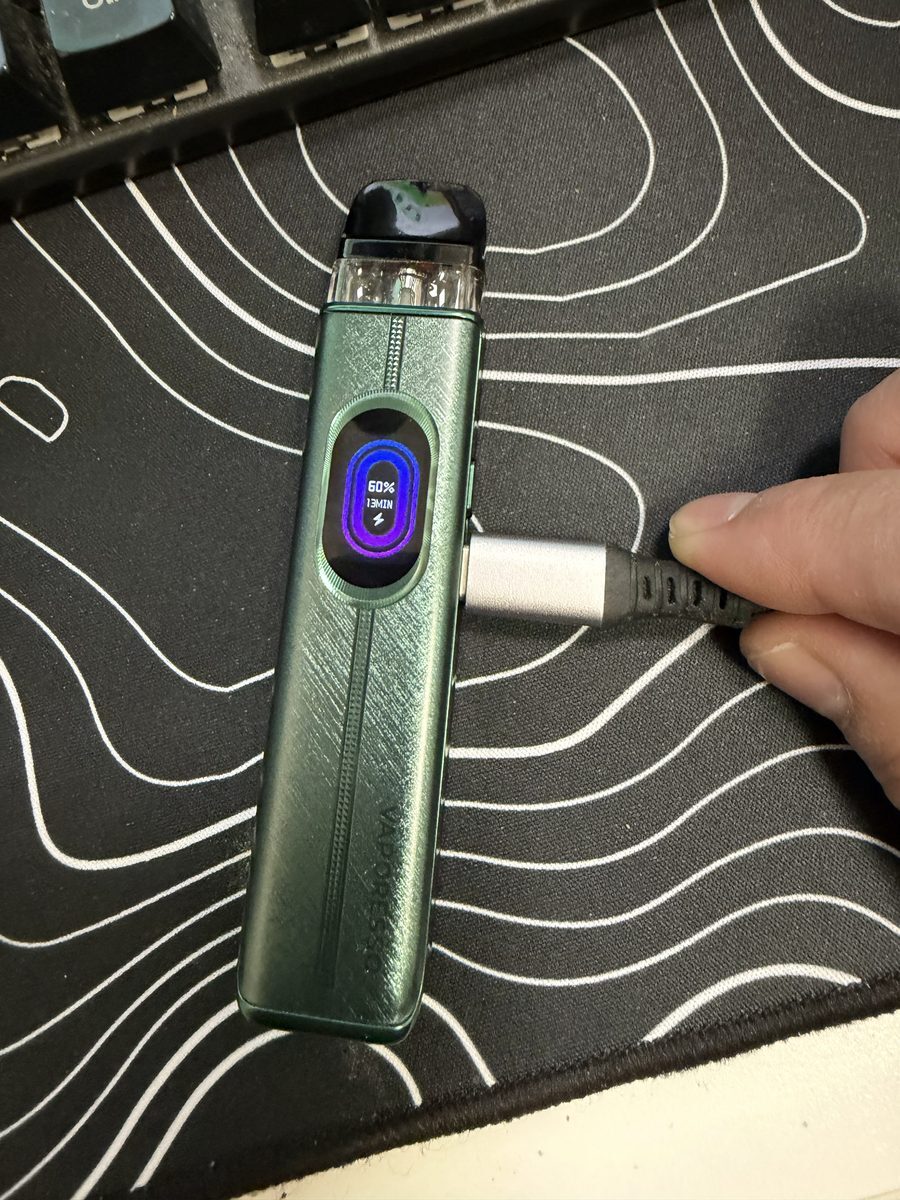 Vaporesso XROS 6 charging over USB-C with the battery percentage shown on screen