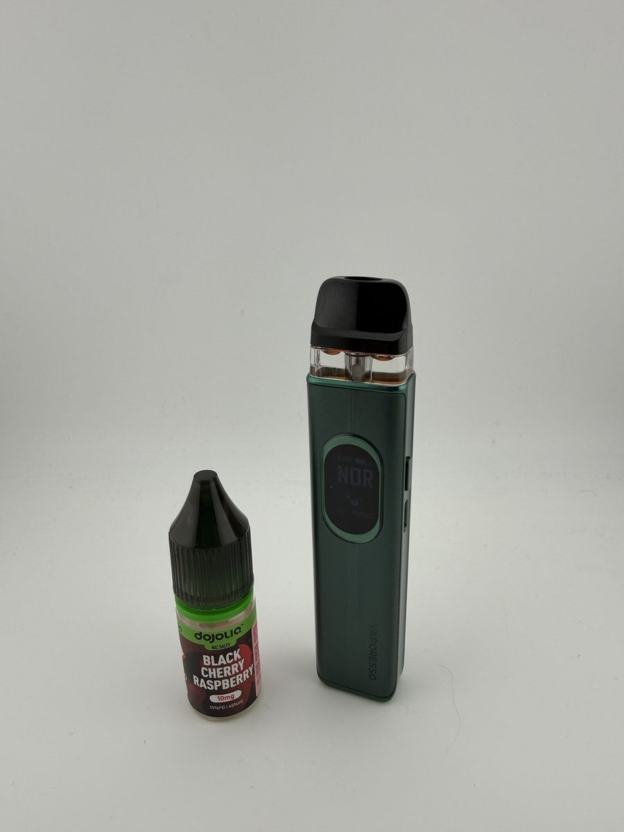 Vaporesso XROS 6 screen showing Normal mode next to a 10ml nic salt bottle
