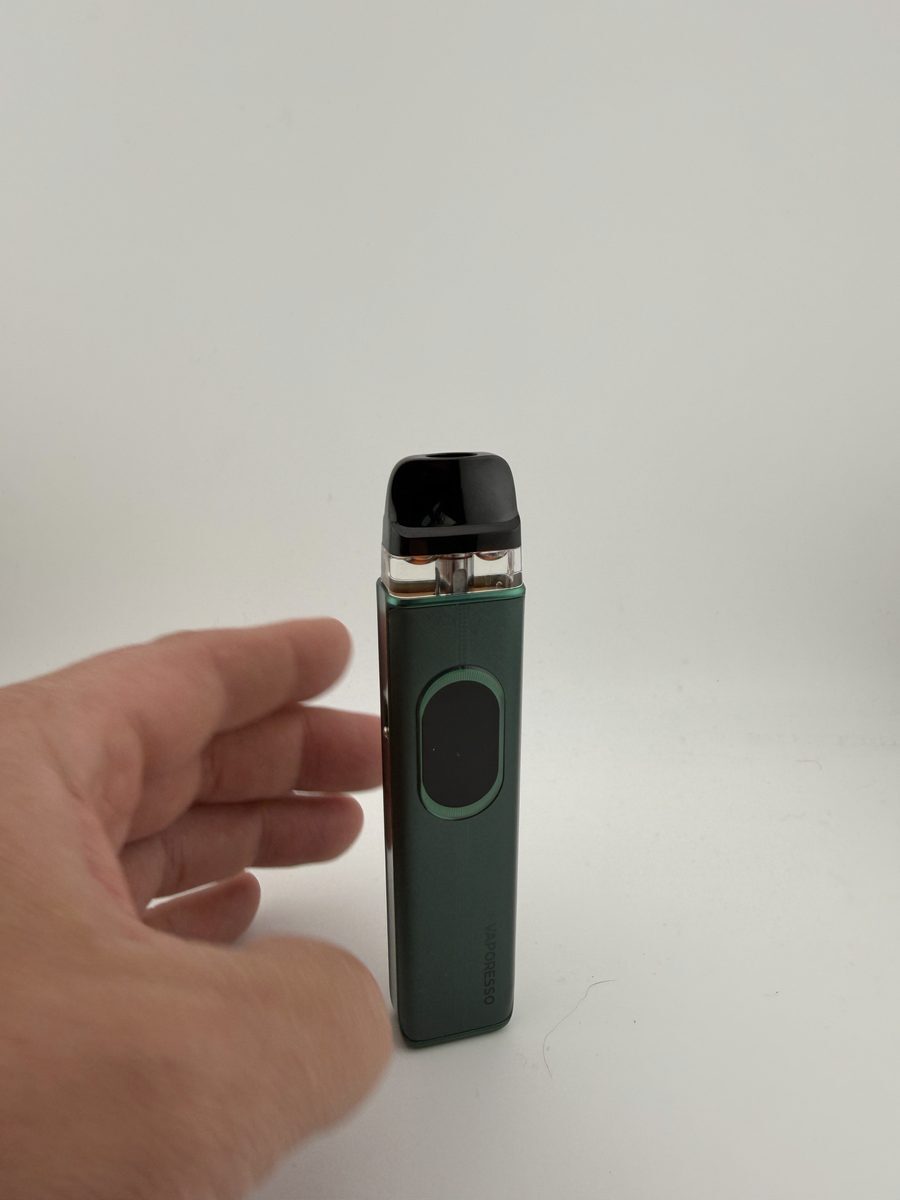 Vaporesso XROS 6 in Silk Green standing upright showing the front face and screen
