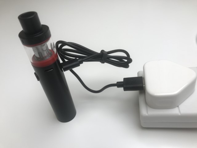 Vape kit being charged via USB cable