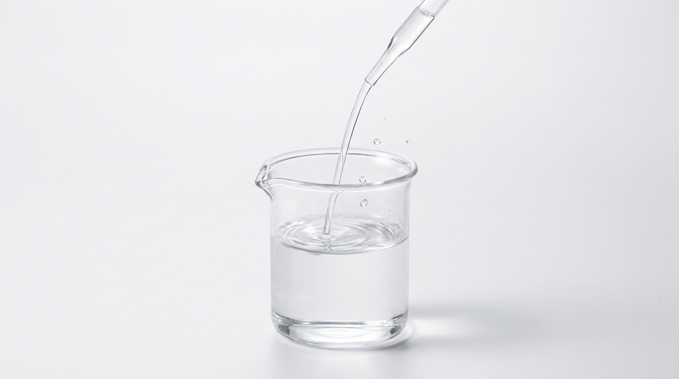 Thin, watery propylene glycol streaming quickly into a glass beaker